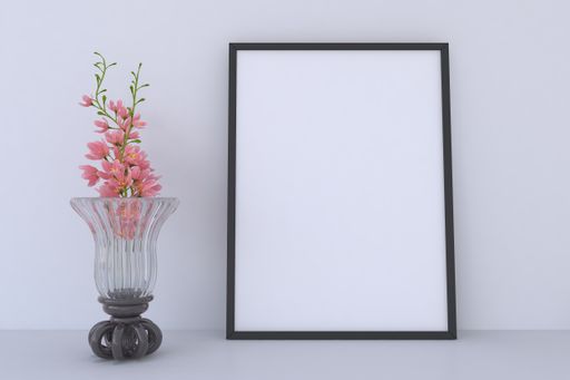A closeup shot of a black frame with a vase on the shelf