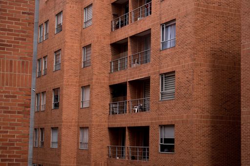 A closeup shot of brick building with balconies