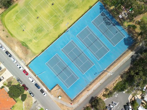An aerial view of blue and green tennis courts in Perth, Western Australia