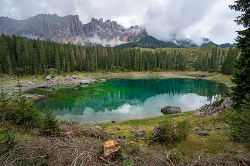 A scenic view of Lake Carezza in the Dolomites, South Tyrol, Italy