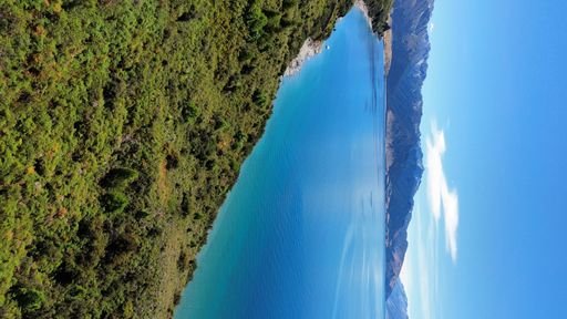 An aerial view of Lake Hawea surrounded by lush greenery. New Zealand