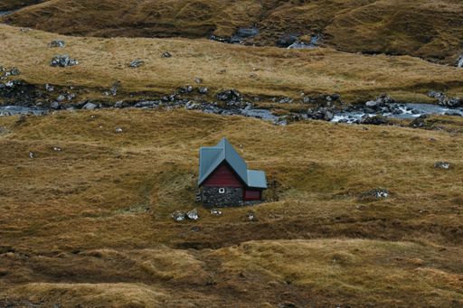 Isolated house near the river in Faroe Islands