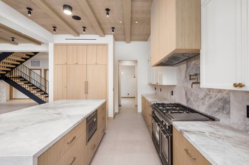 A contemporary kitchen showcasing sleek stainless steel appliances