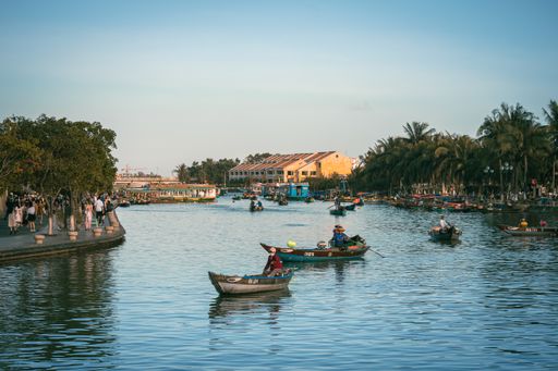 A Group of people sailing together on a river: Hoi An, Vietnam
