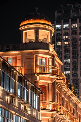 A century-old building with a unique design, still shining brilliantly with lights at night in Wuhan, China