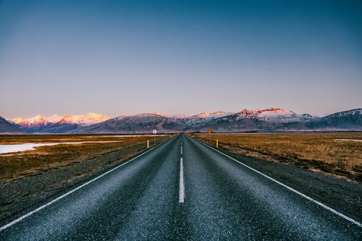 A Ring road number 1 in southern Iceland with mountains and glaciers in the background