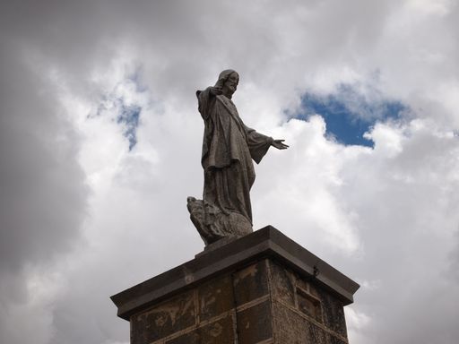 A low angle shot of a statue of Jesus Christ in the small town of Ayllon, Spain