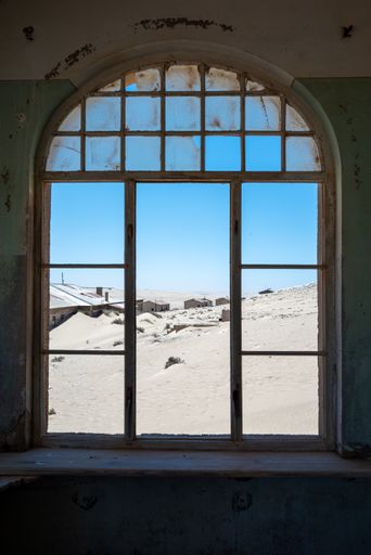 An antique window inside a derelict building
