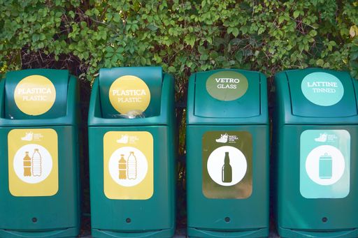 A waste management signs and symbols on a garbage bin