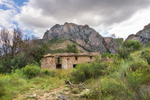 An old abandoned stone house in the wild nature