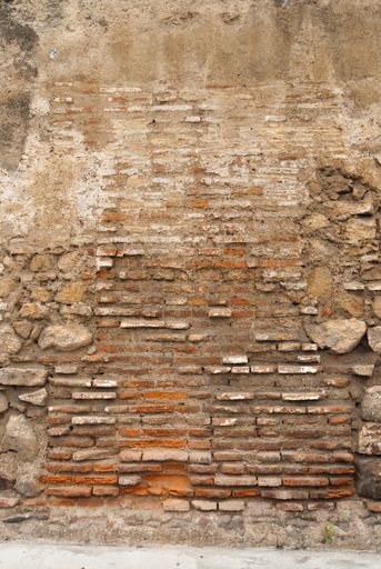 Textures generated in paintings on walls exposed to the elements in the colonial city of La Antigua Guatemala, detail accidental public abstract art.