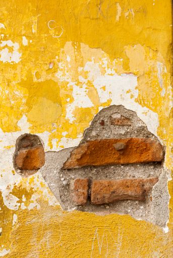 Textures generated in paintings on walls exposed to the elements in the colonial city of La Antigua Guatemala, detail accidental public abstract art.