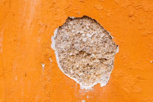 Textures generated in paintings on walls exposed to the elements in the colonial city of La Antigua Guatemala, detail accidental public abstract art.