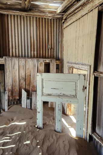 An Old, abandoned sand-filled building in the desert. Kolmanskop, Namibia.