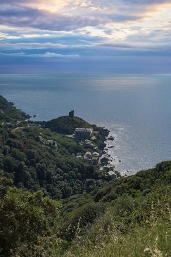 Corsica, a traditional village in the mountain, ancient fortress, with the sea in background