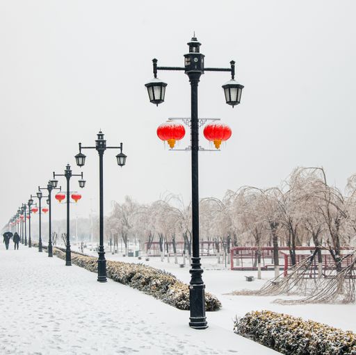 The red lanterns hung on the street lights of a snow-covered park in Wuhan, China for the Spring Festival