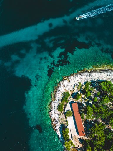An aerial view of a serene coastal town surrounded by turquoise waters. Croatia