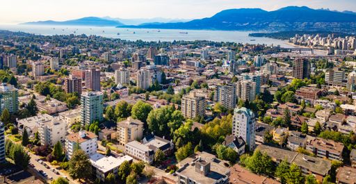 An aerial view of Vancouver, BC, Canada with mountains in the background