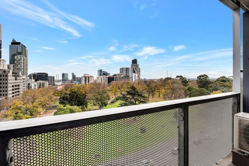 A balcony with a view of the cityscape