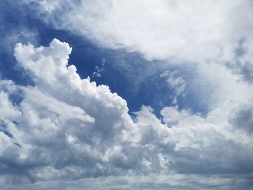 A low angle shot of white clouds in Malaga, Spain