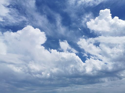 A low angle shot of white clouds in Malaga, Spain