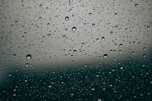 A closeup of rain droplets on a window
