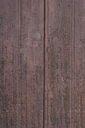 Old wooden texture of windows and doors weathered by time with cracks and rusty nails