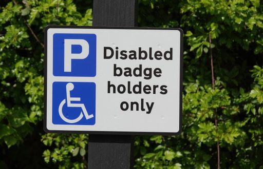 A traffic sign displaying the message “disabled badge holders only”