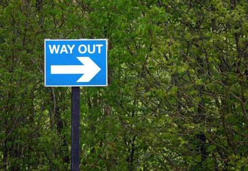 A way out traffic sign in blue and white colors