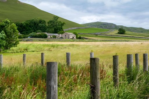 Malham Cove is a large curved limestone formation 0.6 miles north of the village of Malham, North Yorkshire, England. It was formed by a waterfall car