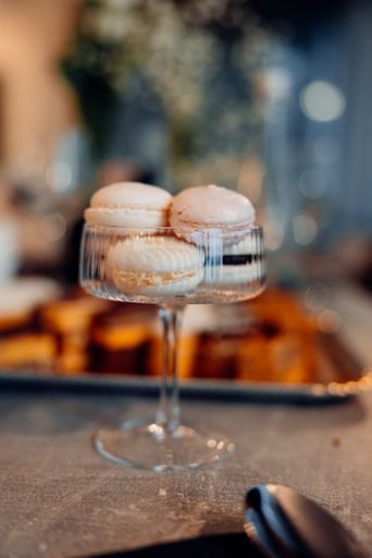 The delicious macarons placed in a glass
