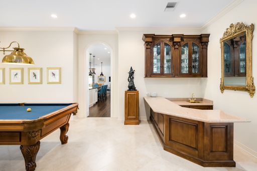 Luxurious mansion with spacious open-concept kitchen, dining area, and game room