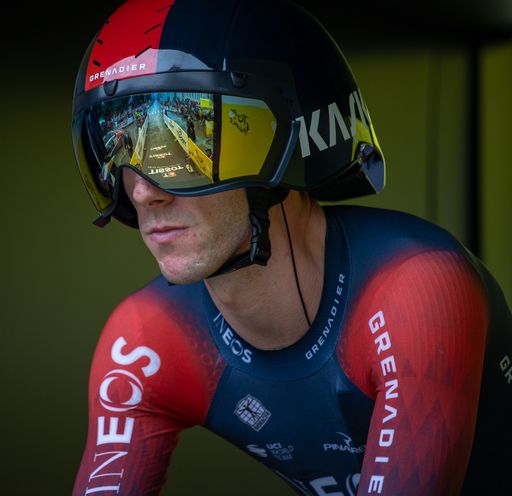 Cyclist in helmet and goggles on bike