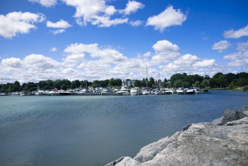 A port with boats and a clear blue sea during daytime