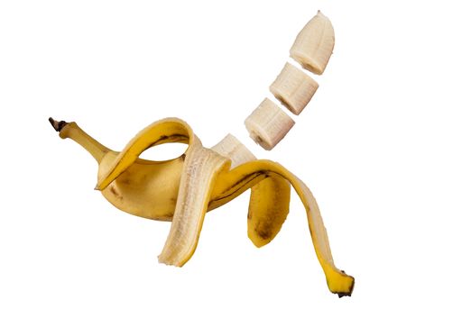 Peeled banana cut in portions on white background, tropical fruit of Guatemala. Musa paradisiaca.
