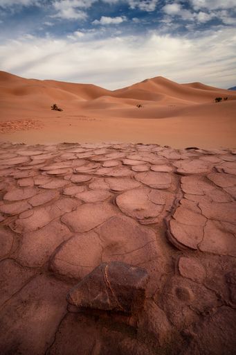 A Sunset light illuminating dunes in the desert