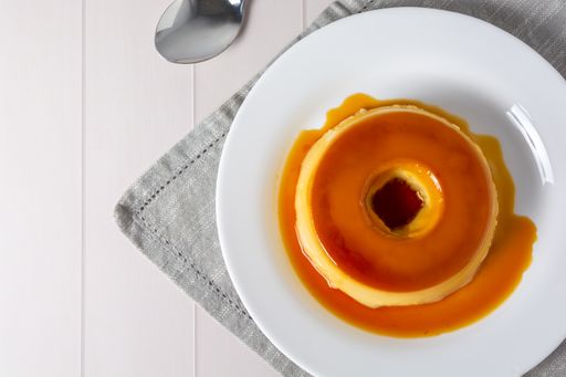 A closeup of a Brazilian pudding known as pudim de leite on a plate