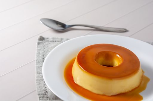A closeup of a Brazilian pudding known as pudim de leite on a plate