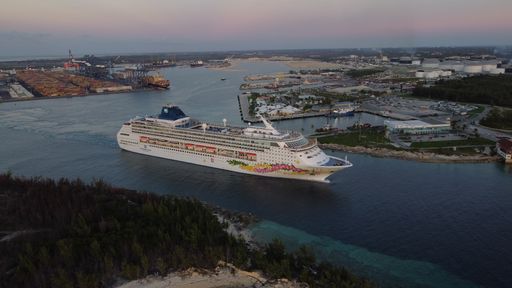 A massive cruise ship leaving port Freeport Bahamas