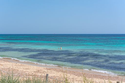 Formentera, Spain: June 12, 2021: People on Migjorn beach in Formentera in Spain in Times of COvid 19