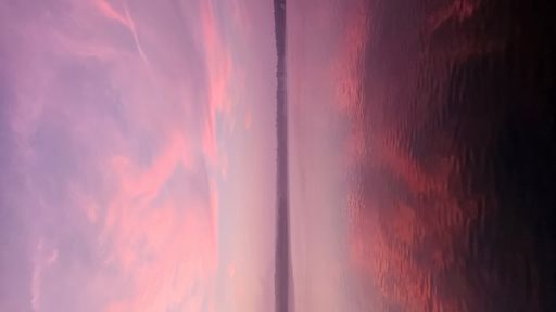 Amazing beautiful pink sunset reflection in the sea