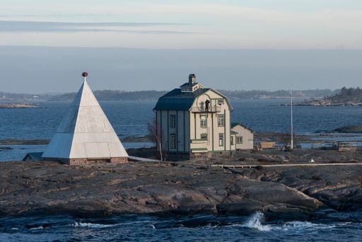 A House and a lighthouse on KOBBA KLINTAR in the Aland archipelago, popular tourist destination