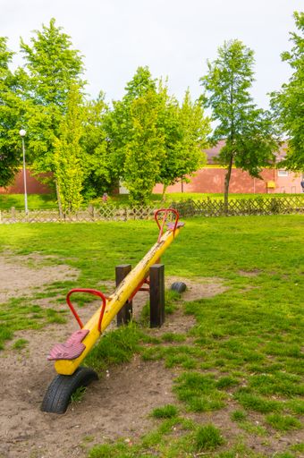 A playground with colorful seesaws during daytime