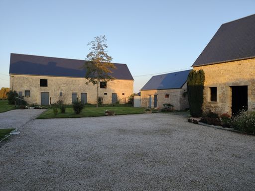 Beautiful classic French farmhouse, old stone and wood architecture with a well-kept courtyard. It is a cozy rustic hotel. It's the sunset