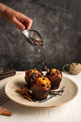 A closeup shot of delicious muffins with chocolate chips and cinnamon