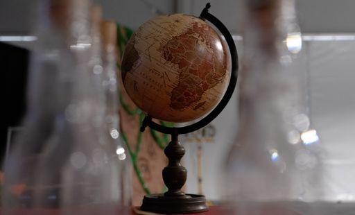 A closeup shot of a small globe on a table at a labaratory
