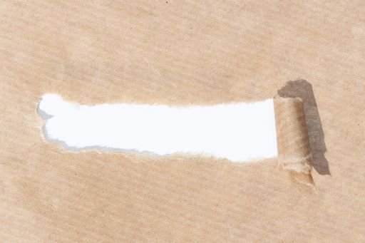 Brown paper with torn stripe and white paper background to insert text. Template mock up