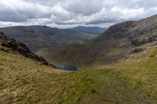 A beautiful landscape with a small lake in mountains in Kerry