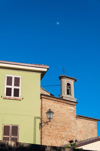 A shot of the buildings next to each other toned with different colors in Novilara, Pesaro.