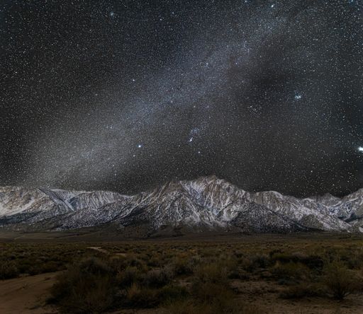 The Milky Way creates a starry night time across the skies above Mt. Whitney in California's Eastern Sierra and lower Sierra Nevada range.